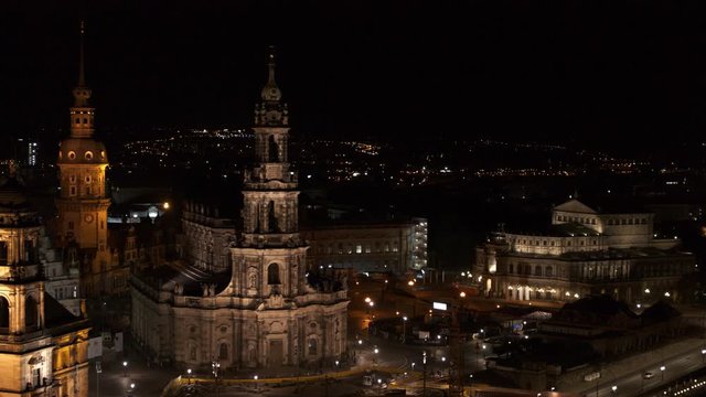 drone flight by night over the historic city of Dresden with the opera house Zwinger and the church dresden kreuzkirche