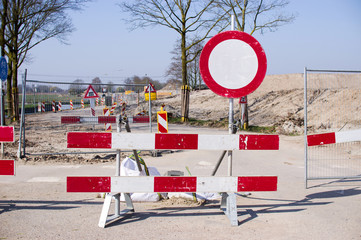Work site closed with barriers with prohibition sign for roadworks