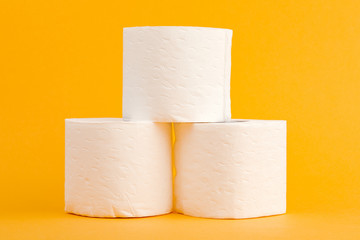 Toilet paper roll on a yellow background.