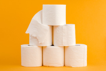 Toilet paper roll on a yellow background.