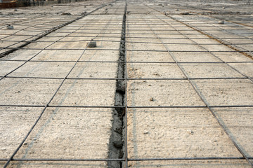 Iron wire mesh for concreting floors. Rebar grids at the construction site. Accessories for...