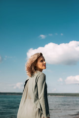 woman walks along the beach