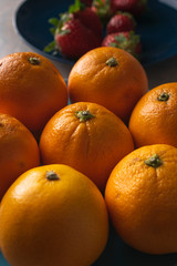 Fruit plate with oranges on a dining table for healthy dish