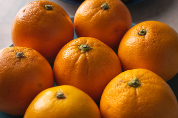 Fruit plate with oranges on a dining table for healthy dish