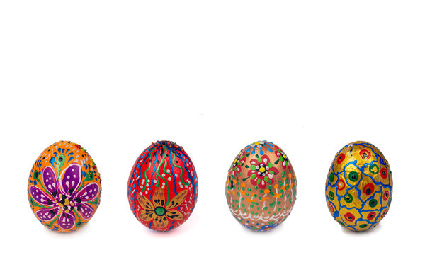 Beautiful Easter eggs painted by hand with acrylic paints. Isolated image on a white background