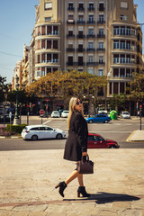 young woman walking in the city