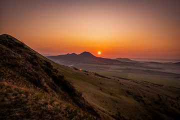 Naklejka premium Rana is a significant three-peak mountain 457m. in the western part of Ceske stredohori. The Rana National Nature Reserve is situated on the south-western hill of the trike, is the center of paraglide