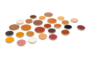 Round multicolored make up eyeshadows isolated on white.