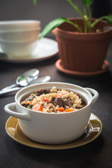 Homemade beef and barley soup. Gray background