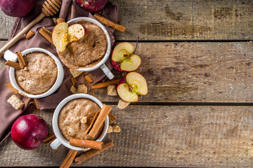 Quick autumn dessert idea. Autumn apple pie mugcake with red apples, cinnamon, spices, Rustic...