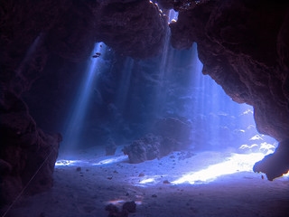 Underwater photo of scenery with sunlight and beams underwater	