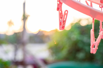 Picture of a clothespin with a sunset backdrop