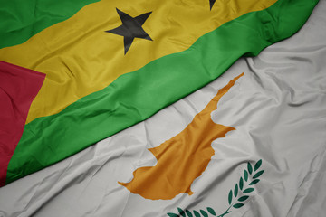 waving colorful flag of cyprus and national flag of sao tome and principe .