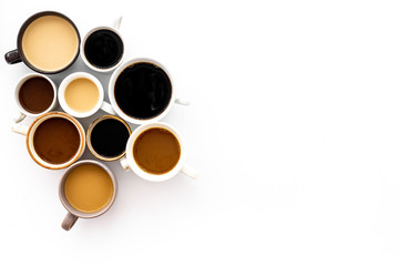 Many cups of coffee on white background top view copy space