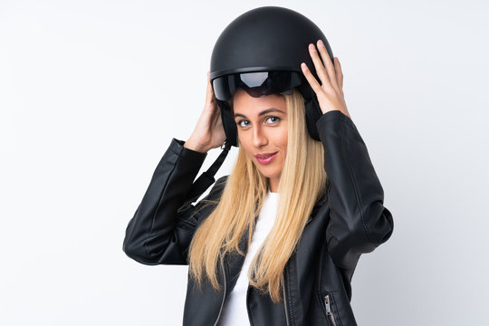 Young Uruguayan woman with a motorcycle helmet over isolated white background