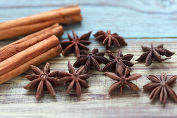 Cinnamon sticks and aniseed stars close up on a wooden table