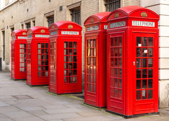 Row of red telephone boxes, London,, UK