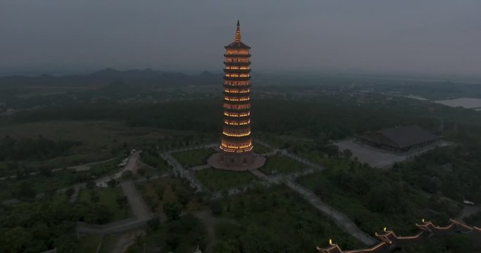 Night Aerial Approach Shot of Xa Loi stupa at Bai Dinh Temple Spiritual and Culture Complex in Ninh Binh Vietnam, the largest spiritual tourist place in Vietnam