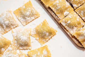 Fresh homemade italian pasta ravioli with ricotta and spinach. The process of cooking.