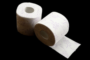 Tissue roll isolated on black. Toilet paper bathroom background. Cleaning concept product photograph for advertising