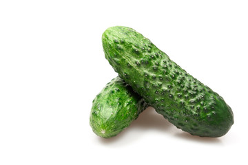 Green fresh cucumber isolated on white backround .