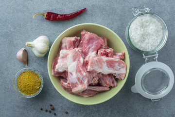 Raw meat. Pork ribs in a ceramic bowl. View from above.