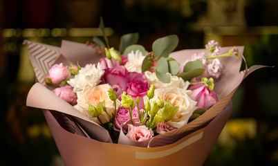 Bouquet of pink roses and white gerberas.