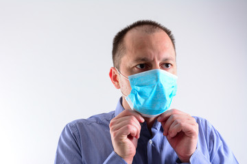American man wearing a protective face mask to prevent virus infection
