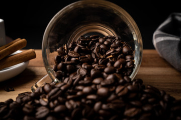 coffee beans spilling out a cup