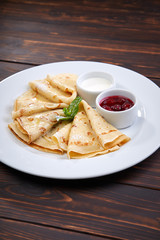 pancakes with sour cream and berry sauce