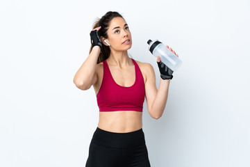 Sport woman over isolated white background with sports water bottle