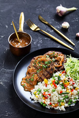 fried hamburger steaks with onion gravy and salad