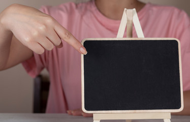 woman hand holding chalkboard