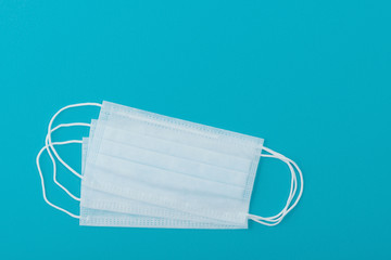 Medical mask protective virus, flu, disease. Isolated on a blue background.