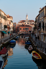 20 February 2020, VENICE, ITALY: Venice cityscape with narrow street and canal
