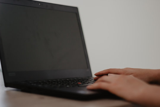 typing on laptop