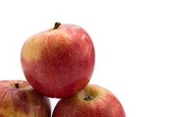 three red apples on white background