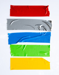 Set of yellow, green, black tapes on white background. Torn horizontal and different size sticky...