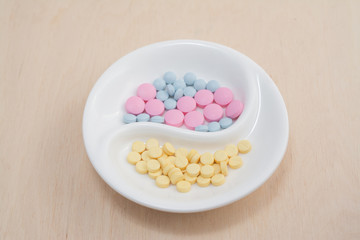 plate with colored pills against poisoning