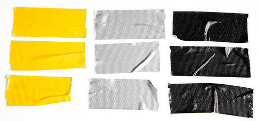 Set of yellow, gray, black tapes on white background. Torn horizontal and different size sticky...