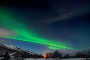 Northern light sky with stars. Winter landscape at night