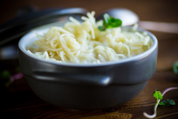 sweet boiled vermicelli with milk in a ceramic bowl