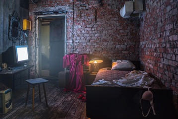 old interior of maniac room, with tv and small smoke inside
