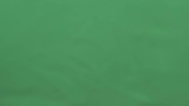 potato chips in free fall on a green background. Slow motion. Pringles