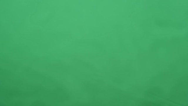 potato chips in free fall on a green background. Slow motion. Pringles