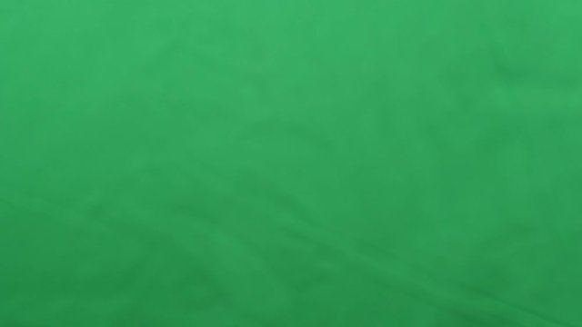 potato chips in free fall on a green background. Slow motion. Pringles