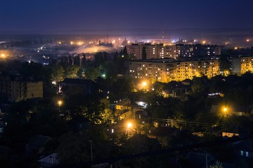 Fototapeta na wymiar Panoramic view on Svetlovodsk city at night, Kirovohrad region, Ukraine. Top view, drone view on Taburische region in Svitlovodsk. Soft selective focus.