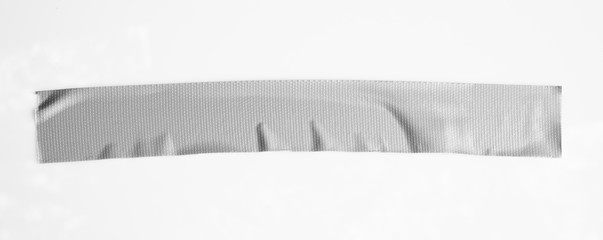 Set of gray tapes on white background. Torn horizontal and different size sticky tape, adhesive pieces.