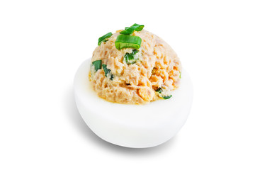 Canned Tuna deviled eggs with scallion on a white isolated background