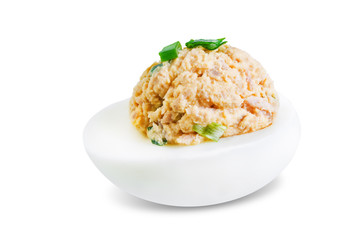 Canned Tuna deviled eggs with scallion on a white isolated background
